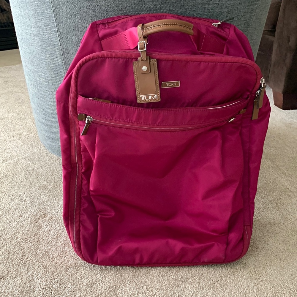 Used Tumi soft carryon roller bag